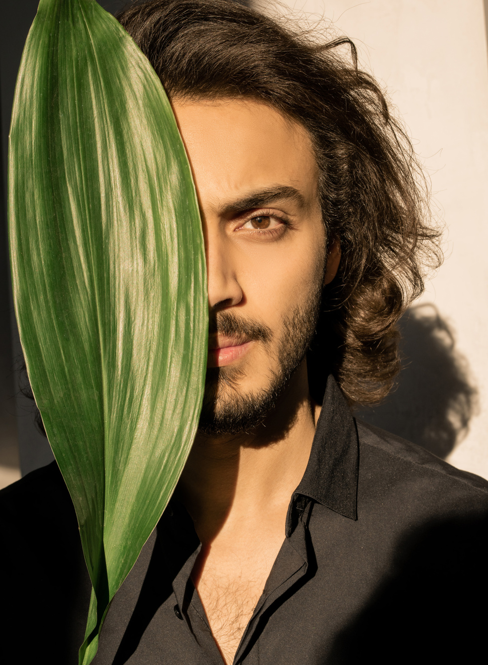 Photo Of Man's Face Covered With Leaf